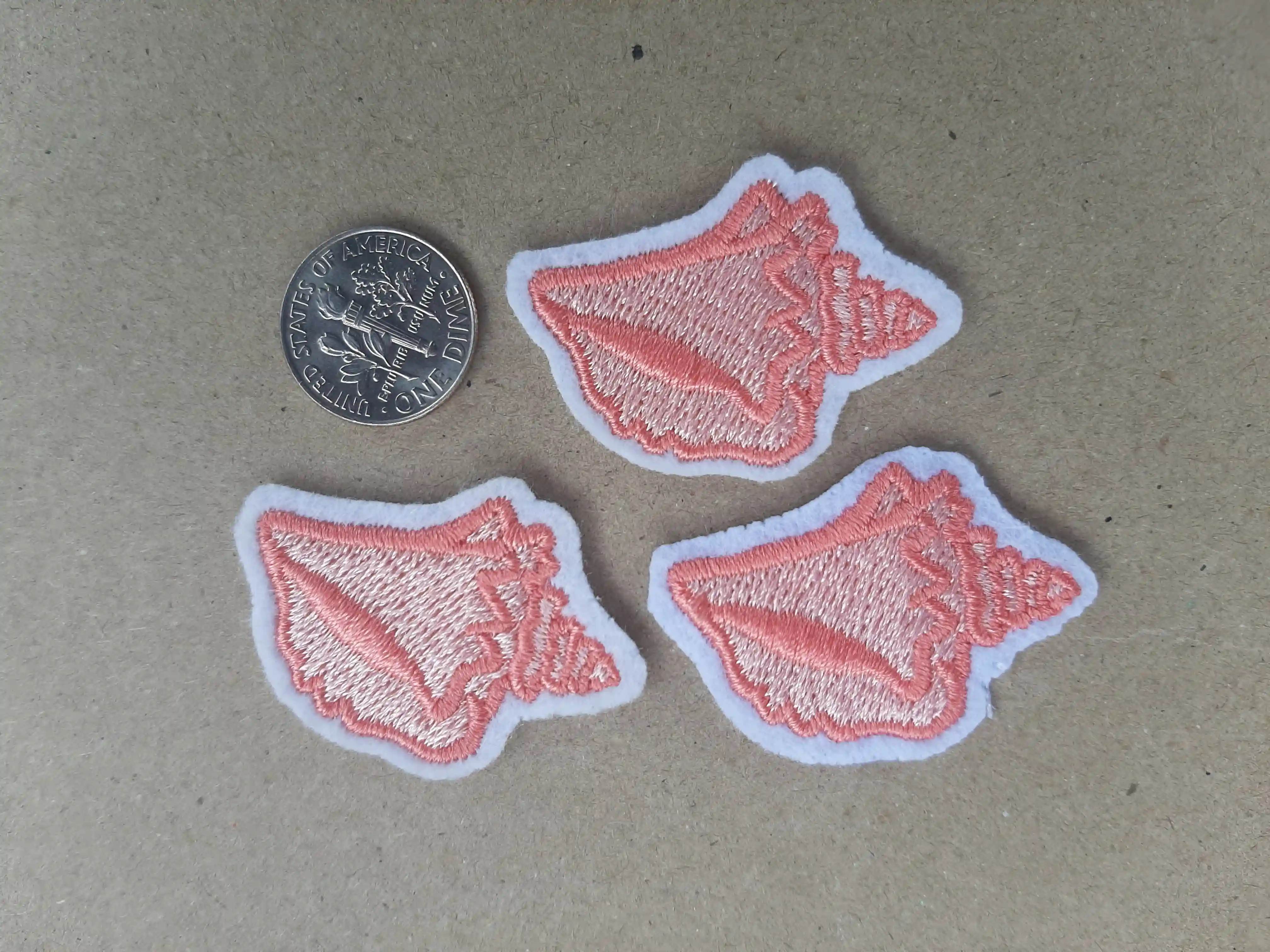 Tiny Embroidered patches are elegant and these Conch shells are almost the size of a Dime.  Perfect Gift and Seasonal Resort Industry collection Tiny Conch Shells Coastal_Sea Shells